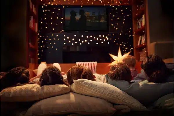 family movie night with a comfy couch and festive lights